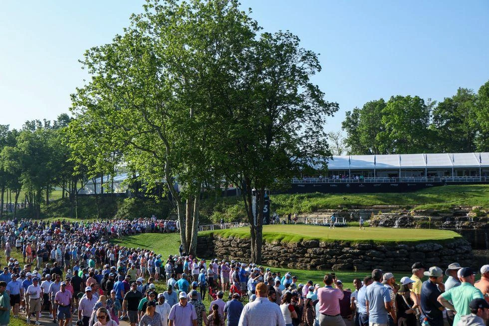 PGA Championship fans gather around fairways during the chaotic Friday round.
