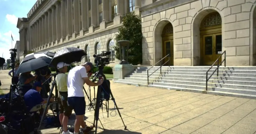News crews and reporters cover developments in the Scheffler arrest case.