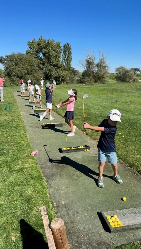 Junior golfers train during grassroots development programs supported by golf organizations.